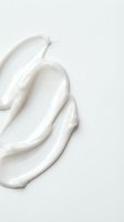 Creamy white skincare product swatches with rich texture, ideal for cosmetics, beauty, and wellness marketing materials.