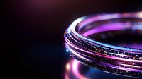 Glowing circular lines with neon pink and blue light trails against dark background create futuristic abstract composition with sparkle effects and motion blur.