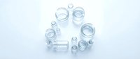 Clear glass jars and bottles arranged in circle on white background, isolated containers for storage, packaging, and design projects.