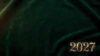 Close-up of luxurious dark green velvet fabric texture with gold 2027 numerals, suitable for New Year celebrations, holiday designs, and premium event graphics.