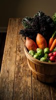 Wooden basket filled with fresh organic vegetables including kale, carrots, Brussels sprouts and radishes on rustic table for cooking and healthy eating.