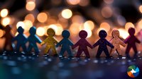 Paper cutout figures holding hands in silhouette against warm bokeh lights background, symbolizing unity, friendship, diversity and community connection.