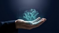 Businessman hand holding glowing digital gear mechanism hologram on dark background, representing technology innovation, engineering solutions, and industrial automation for business concepts.
