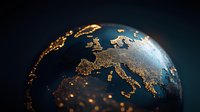 Glowing golden lights representing population density on dark blue globe surface focusing on European continent with detailed geographic relief and borders.