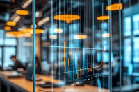 Modern office interior with hanging orange pendant lights and glass partition creating depth and bokeh effect against blue-tinted windows, showcasing contemporary workspace design.