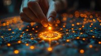 Glowing orange spiral pattern with magical light effects and bokeh on dark textured surface. Hand placing luminous element creating mystical atmosphere.