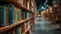Vintage books on wooden shelves in atmospheric library with warm lighting and blurred background creating cozy academic reading environment.