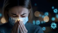 Young woman wearing protective face mask sneezing with glowing virus particles floating in dark background, concept of disease prevention and infection spread.