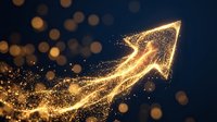 Golden arrow pointing upward made of glowing particles and sparkles on dark blue background, representing growth, success, progress and financial increase for business concepts.