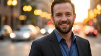 Professional Caucasian businessman smiling confidently on urban street at dusk with warm bokeh lights and traffic background for corporate marketing.
