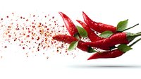 Fresh red chili peppers with green leaves and scattered chili powder creating dynamic motion effect on white background for food packaging design.
