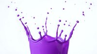 Dynamic purple liquid splash with flying droplets frozen in motion on a white background, capturing vibrant energy and fluid movement.