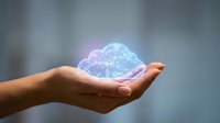 Hand holding glowing digital cloud with network connections representing cloud computing technology and data storage solutions for business.