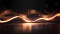 Glowing golden wave of light with sparkles and bokeh effects reflecting on dark surface creates magical atmosphere in abstract composition.