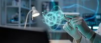 Scientist hands holding glowing atomic structure hologram in modern laboratory for research and scientific discovery applications.