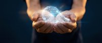 Hands holding glowing digital Earth globe with network connections, representing global technology, innovation, and environmental protection concepts.