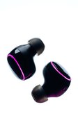 Pair of black wireless earbuds with vibrant magenta accents, isolated on white background. Modern audio technology for music, gaming, and communication design projects.