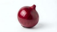 Red onion with glossy skin and natural layers visible, isolated on white background for culinary and food styling projects.