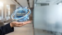 Knowledge credential badge displayed on hand in modern office environment, representing professional certification, expertise verification, and business qualifications for corporate training.