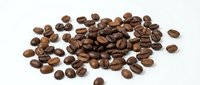 Roasted coffee beans scattered on white background, perfect for cafe branding, packaging design, and culinary projects. Fresh arabica beans isolated.