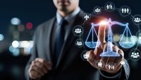 Professional businessman in dark suit touching glowing digital justice scales with network icons representing legal technology and law firm services.