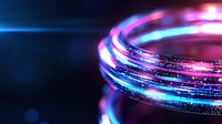Glowing neon rings with blue and pink light effects create futuristic abstract background with bokeh and sparkle elements for technology concept.