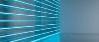 Futuristic empty room with glowing cyan neon light stripes on a dark concrete wall, creating a modern sci-fi atmosphere for product display.