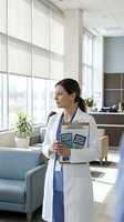 Female doctor in white coat holding medical textbooks in modern hospital lobby with natural light and contemporary furniture for healthcare education.