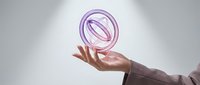 Professional businesswoman presenting purple holographic ring symbol above open palm in modern corporate setting for technology presentations.