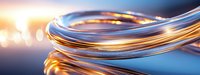 Glowing copper and silver wires intertwined in elegant curves against blurred light background, creating dynamic technological composition with warm and cool tones.