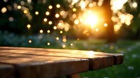 Rustic wooden table corner at sunset with magical bokeh lights and sun flare in background, dreamy summer garden atmosphere with blurred wildflowers.