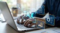 Professional businessman working on laptop with digital tax management icons and financial technology interface for accounting and business solutions.