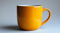 Bright yellow ceramic coffee mug on neutral gray background with soft shadow, minimalist composition for modern lifestyle and beverage concepts.