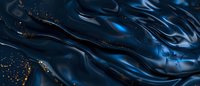 Dark blue liquid waves with golden glitter particles creating elegant abstract texture for luxury backgrounds and design projects.