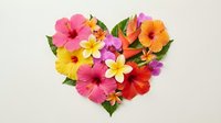 Colorful tropical flowers arranged in a heart shape on white background, featuring hibiscus and plumeria blooms for love and summer designs.