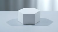 White hexagonal geometric shape on clean surface with soft lighting for modern design projects and presentations.
