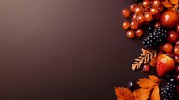 Fresh autumn berries and fall leaves arrangement on dark brown background with copy space for seasonal food design and decoration.