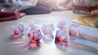 Translucent geometric crystal dice set with pink and blue hues on white surface for tabletop gaming and role-playing adventures.