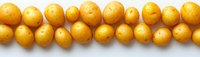 Fresh yellow baby potatoes arranged in neat rows on white background, showing natural organic produce for cooking and food preparation concepts.