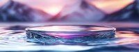 Circular water ripple with crystal-clear droplets creating perfect concentric waves against dreamy mountain landscape backdrop at golden hour sunset.