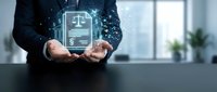 Professional businessman holding glowing digital legal document with scales of justice icon in modern office environment for law technology concepts.