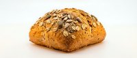 Artisan multigrain bread loaf with seeds and nuts on white background, isolated for bakery design and healthy food concepts.