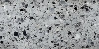 Monochrome terrazzo pattern with black and gray stone fragments scattered on light gray cement background, modern flooring texture for architectural design.
