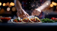 Mexican street tacos with seasoned meat, fresh cilantro, and onions served on corn tortillas with dramatic lighting and spice particles floating in restaurant atmosphere.
