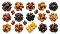 Assorted dried dates and nuts arranged in groups on white background, showcasing variety of cultivars and colors for food, nutrition, and culinary design projects.