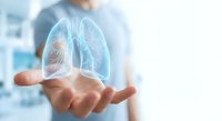Medical professional displaying holographic lung anatomy model with highlighted respiratory system for healthcare education and pulmonology concepts.