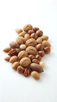 Mixed nuts collection with walnuts almonds hazelnuts pecans on white background for healthy snacking and cooking ingredients.