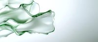 Flowing mint green silk fabric creating elegant waves and folds against white background, soft translucent material catching light with graceful movement.