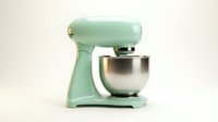Mint green stand mixer with stainless steel bowl isolated on white background, ready for kitchen design, recipes, cooking blogs, bakery websites, and culinary content.
