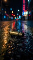 Brass bullet casing on wet asphalt street at night with colorful city lights bokeh reflections creating dramatic urban crime scene atmosphere.